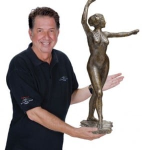 Yank Barry, wearing a Global Village Champions Foundation shirt, offering for sale what purported to be genuine cast of "The Little Dancer, Age Fourteen" by Degas. Yank said this sculpture was worth no less than $15.33 million, but he paid around $1,500 for the sculpture